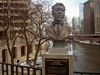 Statue of Jean Baptiste DuSable near the Chicago RiverBlackhistoryheroes.com